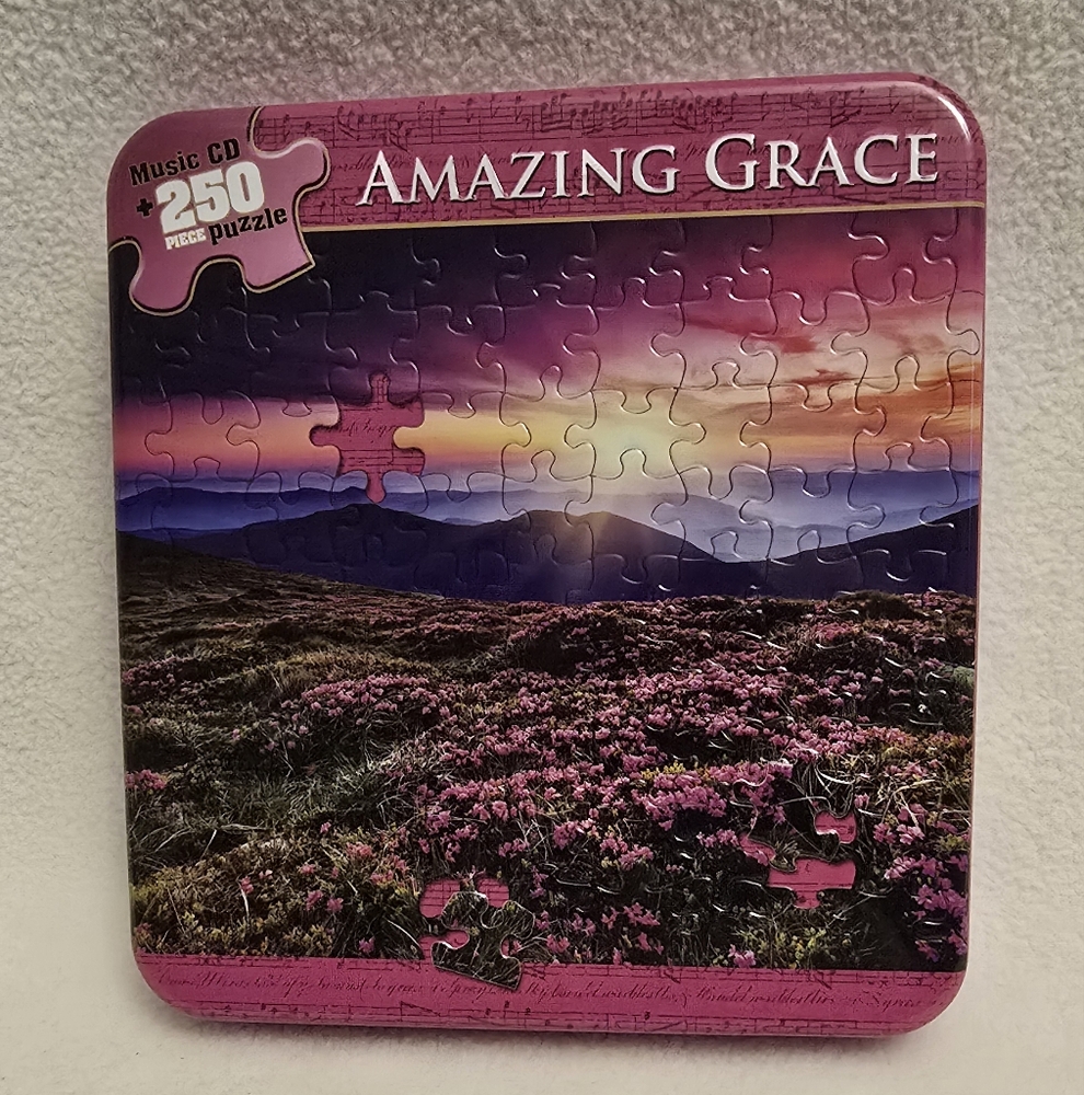 Collectible Tin Containg Cd And 250 Piece Puzzle